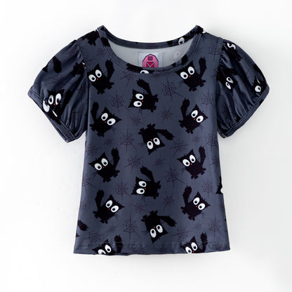 Girls Halloween puffed sleeve top featuring black cats and spider webs on a black background