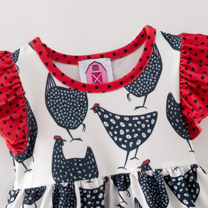 Children's romper 
with chicken pattern and red ruffled collar on a white background
