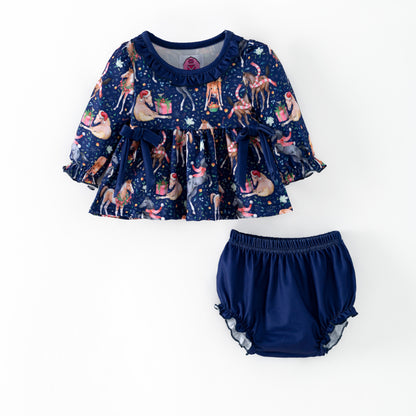 Navy blue children's outfit with printed Christmas horses on top and coordinating blue  bloomers. 