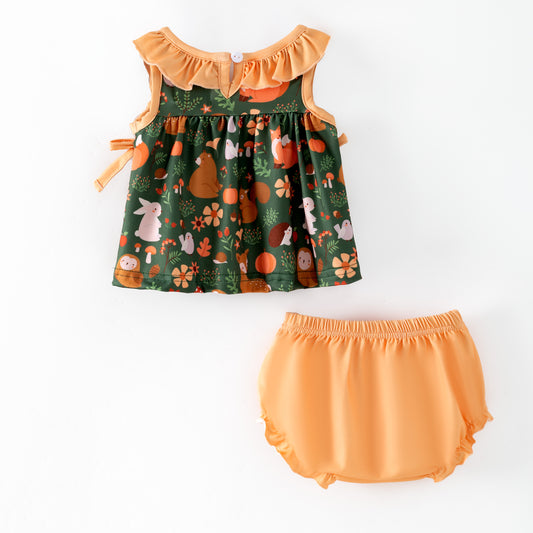 Children's dress with forest animals, ruffled trim and matching bloomers on a dark green background