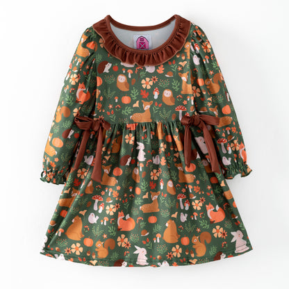 Children's dress with forest animal pattern on a dark green background
