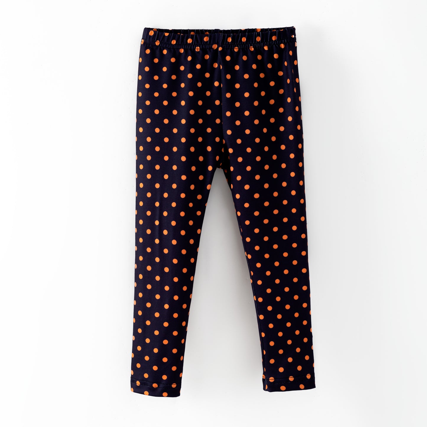 Black leggings with orange polka dots 