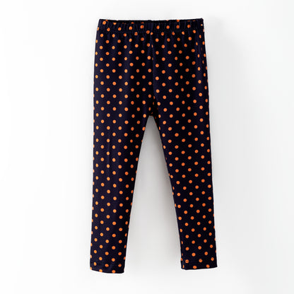 Black leggings with orange polka dots 