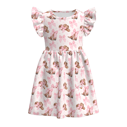 Flutter sleeve dress with pink bows and brown cowboy boots and hats.