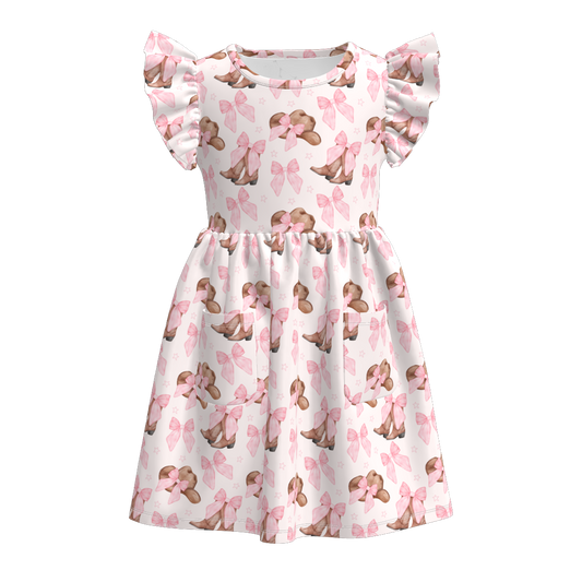 Flutter sleeve dress with pink bows and brown cowboy boots and hats.
