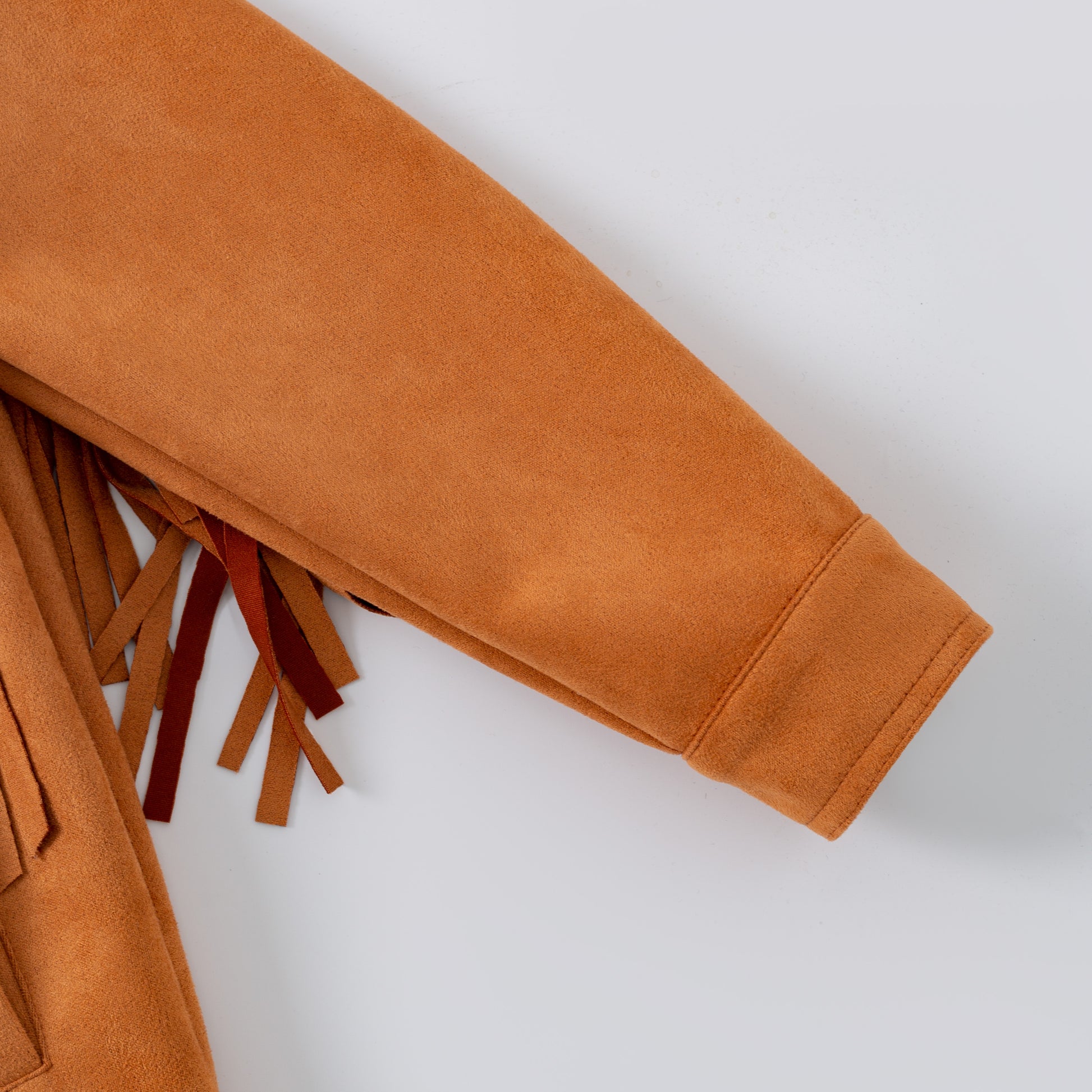 Brown suede jacket with fringes on a white background