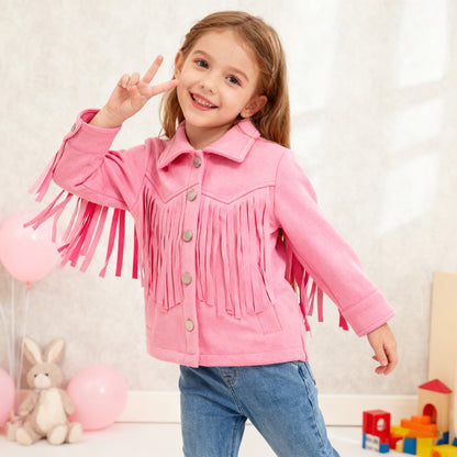 Child wearing a pink fringed jacket with toys in the background