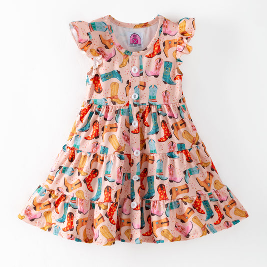 Children's dress with colorful boot pattern and three tiers of ruffles