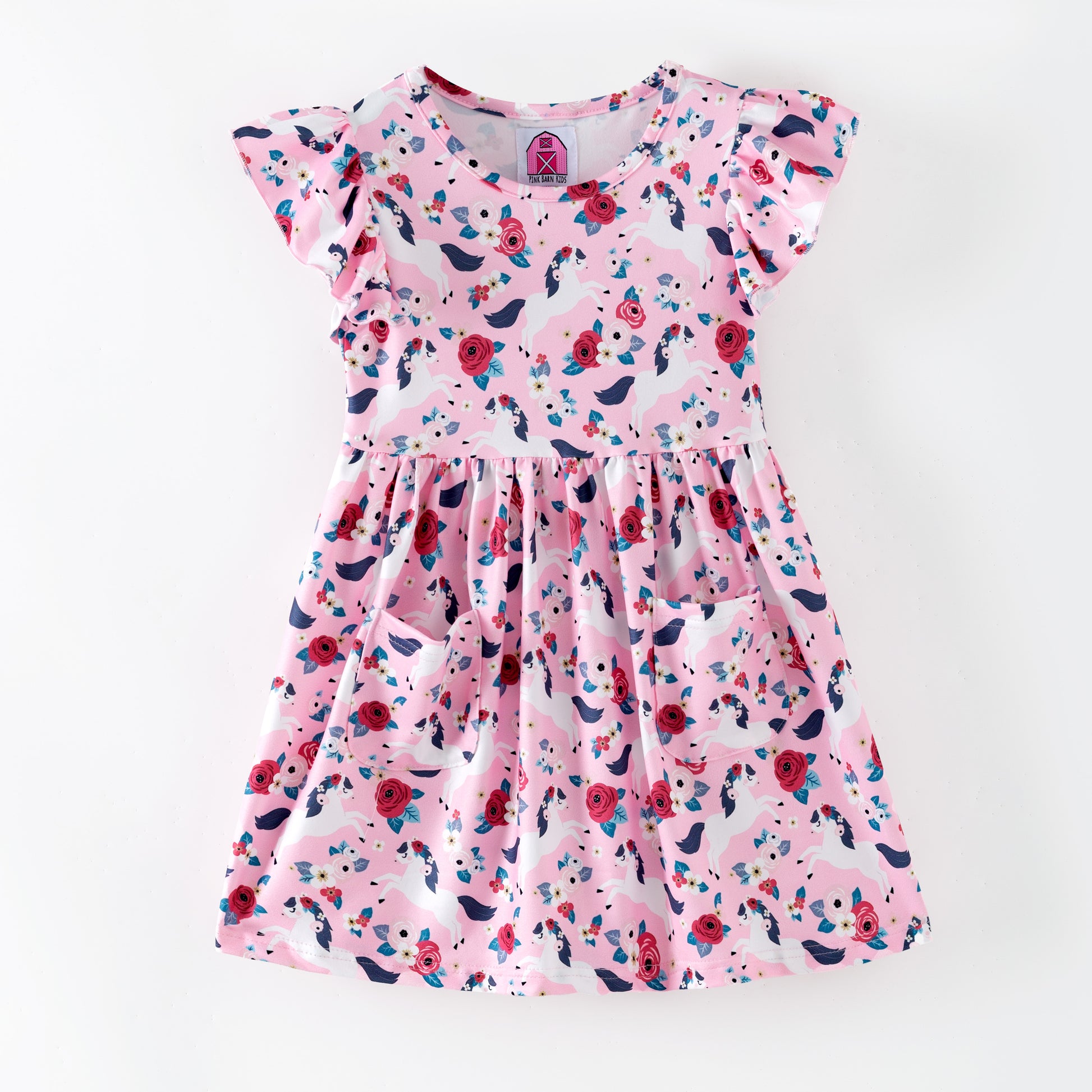 Pink floral dress with white horses on a pink background