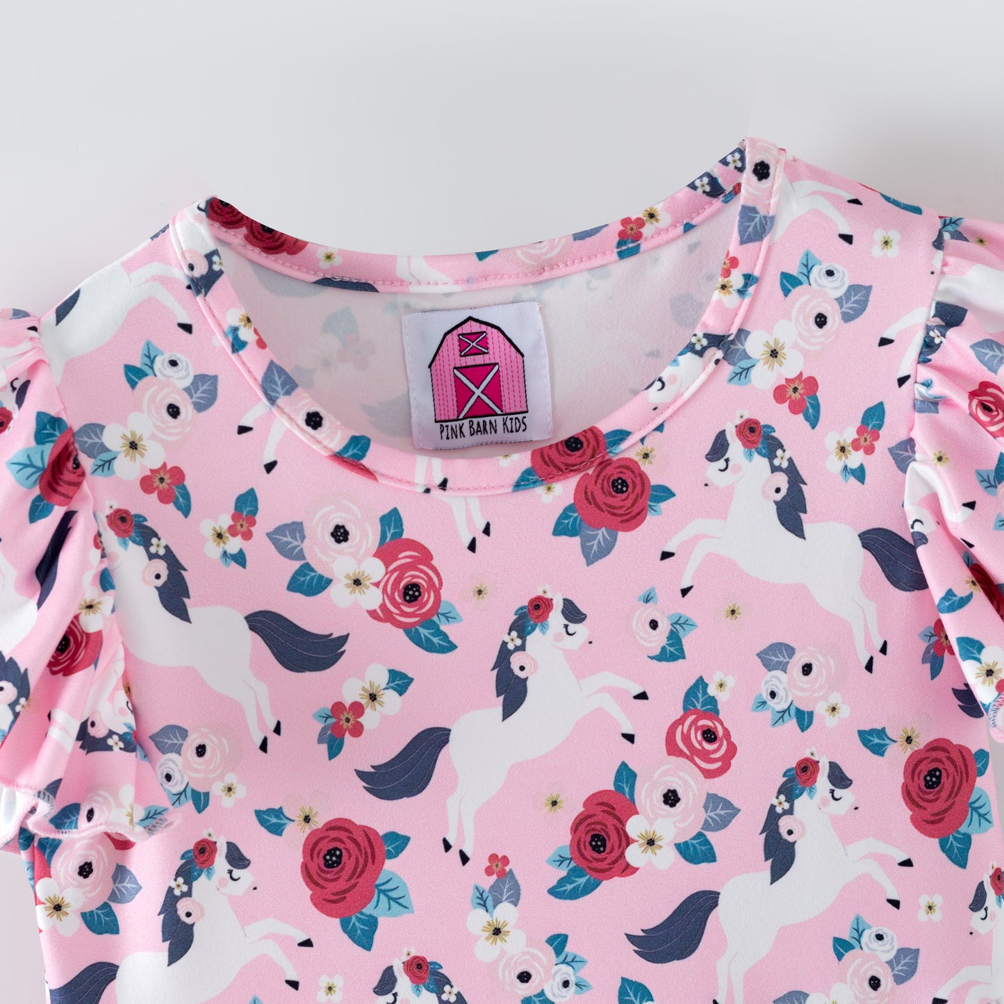 Pink floral dress with white horses on a pink background