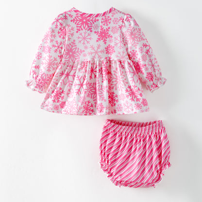 Children's pink and white snowflake dress with matching bloomers on a white background