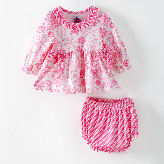 Children's pink and white snowflake dress with matching bloomers on a white background