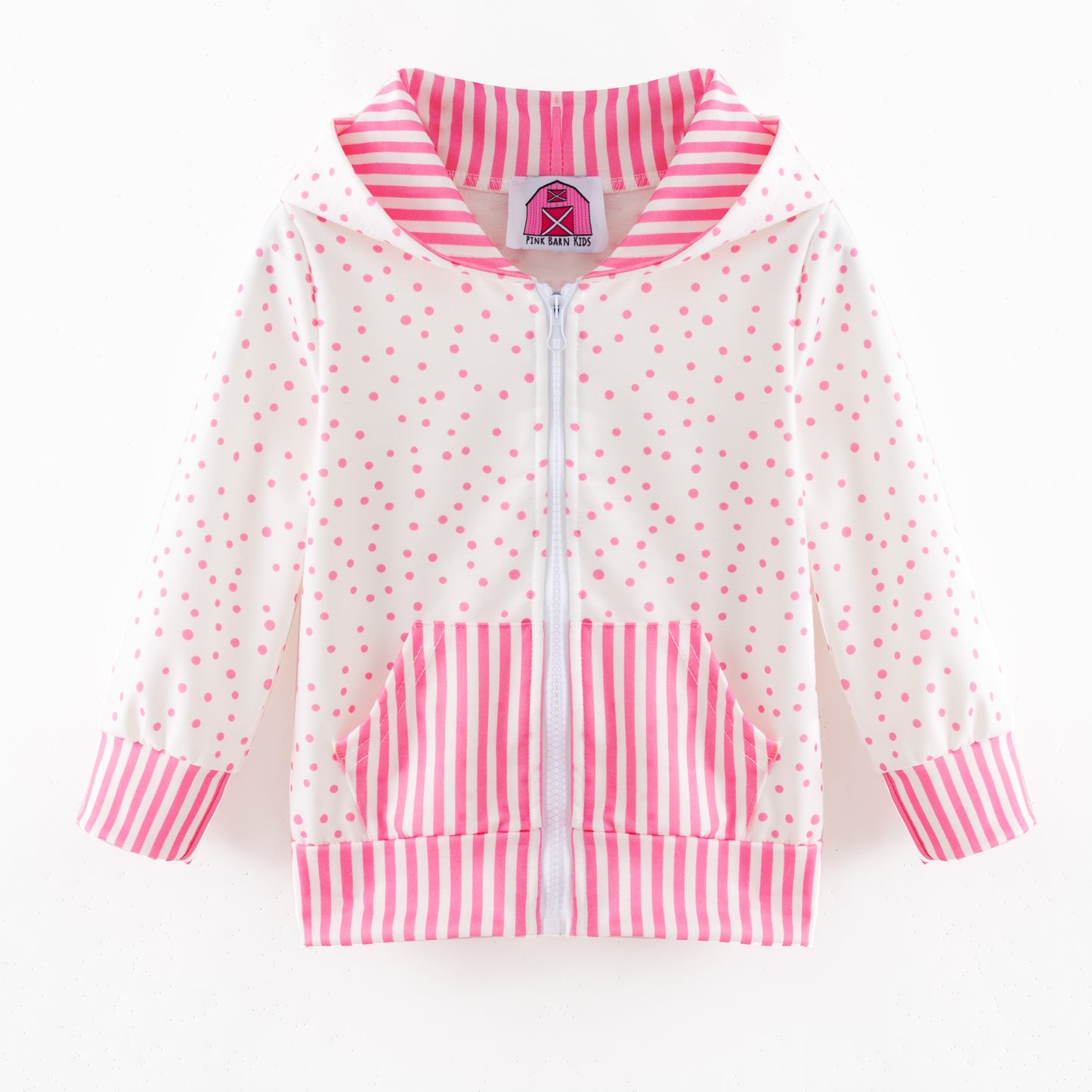Children's jacket with pink and white polka dot pattern on a white background