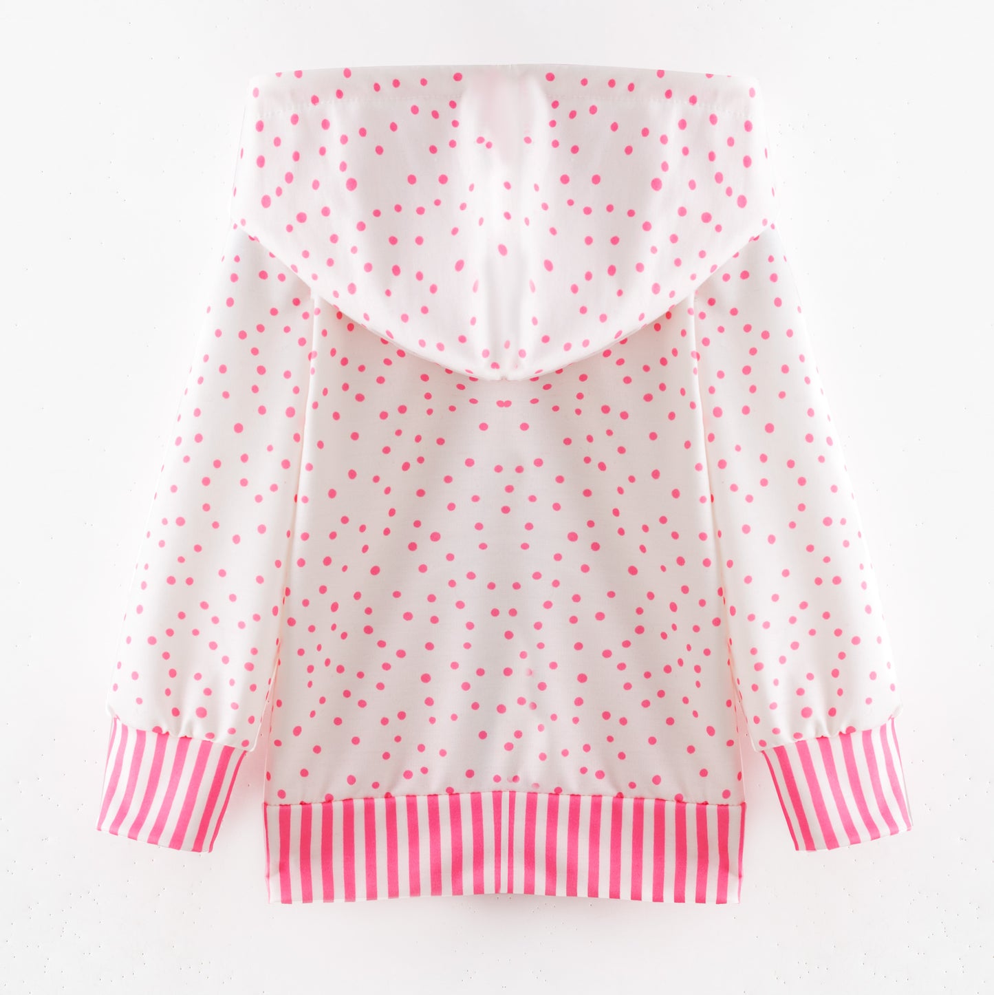 White hoodie with pink polka dots and striped cuffs on a white background