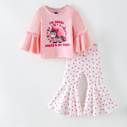 Pink children's outfit with ruffled sleeves and polka dot pants on a white background. Top with cute pony and text "I'm Here! Where's my Pony?"