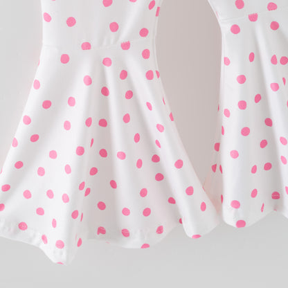 White pants with pink polka dots on a white background